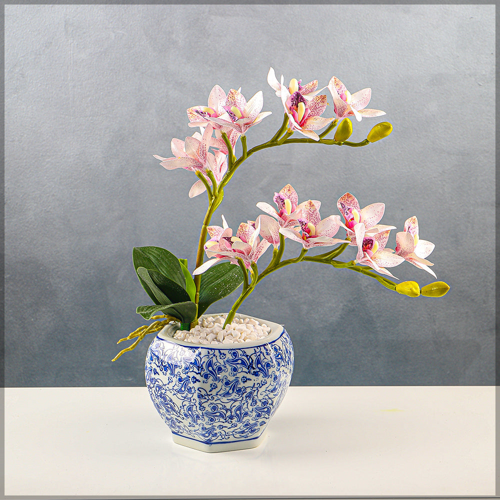 Faux orchids in traditional Chinese vase